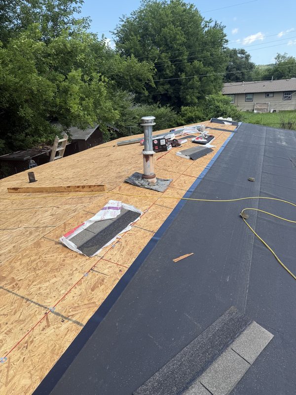 New plywood sheathing and underlayment installed around the vent stack